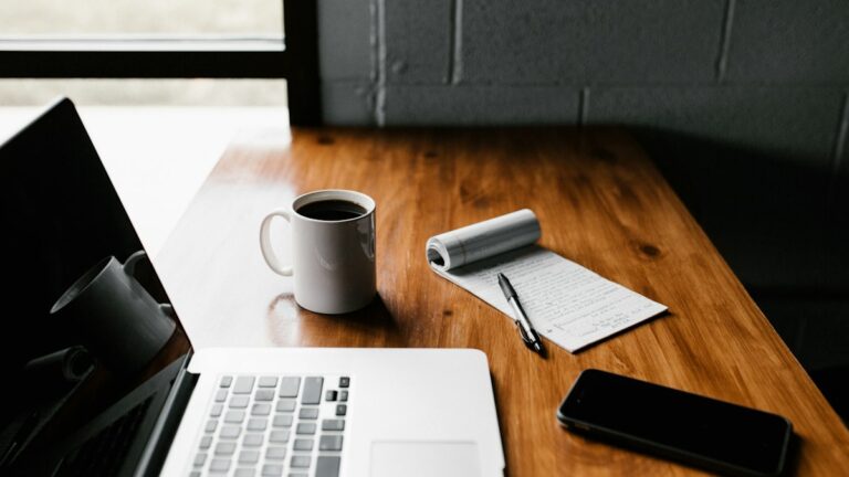 How to start a blog with AI: laptop, coffee, and a writing plan