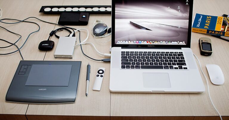 Freelancer editing work on laptop at home