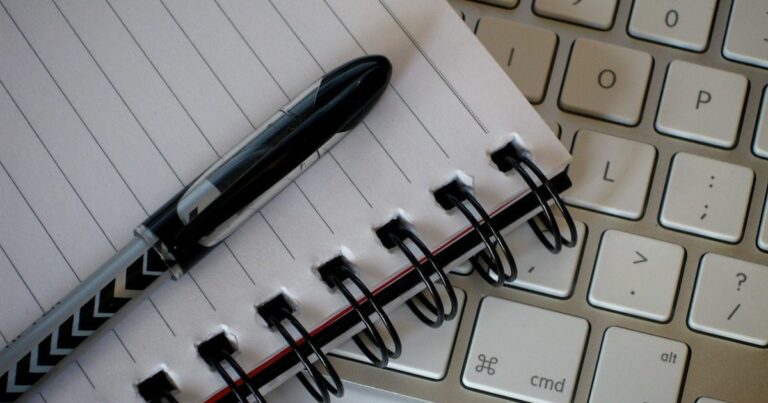 Writing tools notebook and pens on desk